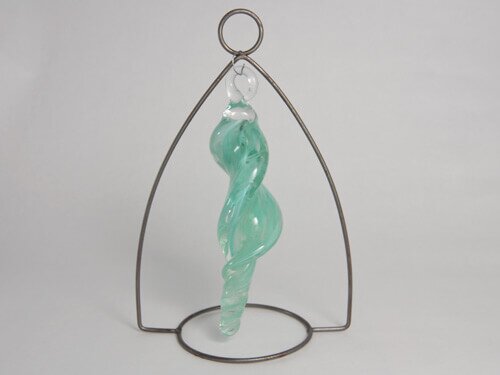 Sculpted glass icicle in stand